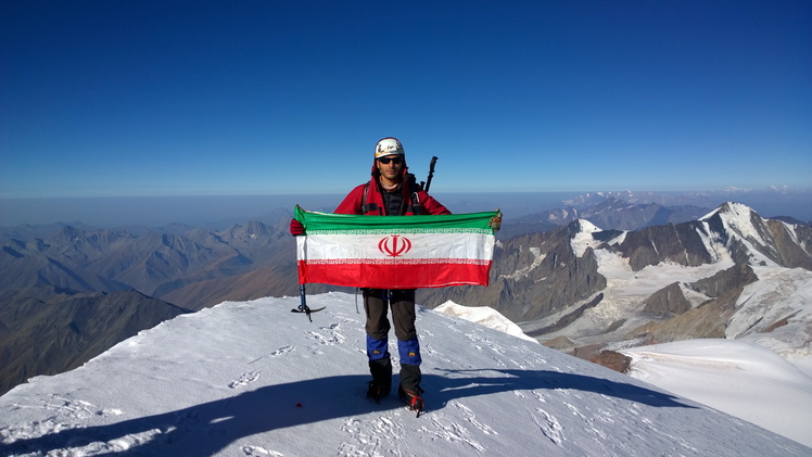 Iran flag on the top of the kazbek peak, Kazbek or Kasbek