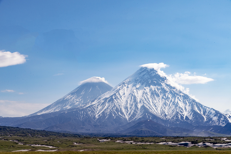 Kliuchevskoy, the highest stratovolcano of Eurasia, partly hidden behind Kamen, Kliuchevskoi