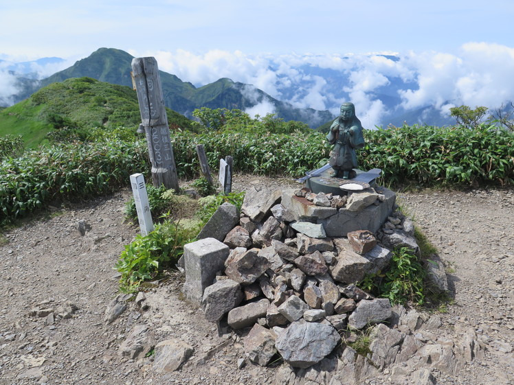 Statue of Japanese god at the peak of Echigo Komagatake, Mount Echigo-Komagatake