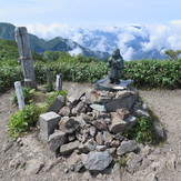 Statue of Japanese god at the peak of Echigo Komagatake, Mount Echigo-Komagatake