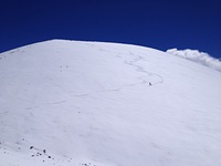 Snow surfing a cone near the summit, Mauna Kea photo