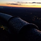 Railing atop Mt Tom, sunset in the distance