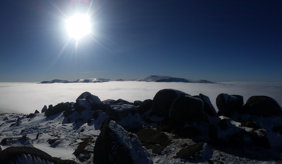Summit of Bynack with Ben Macdui & Cairngorm floating in the distant clouds., Bynack More