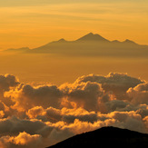 Rinjani at a distance of 106 km to the east,  after sunrise, Mount Agung